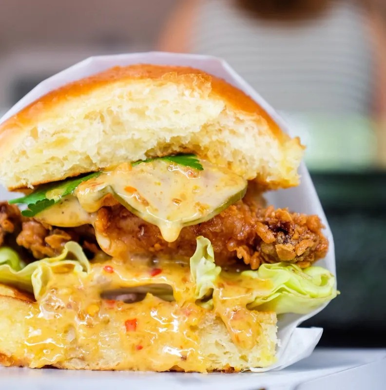 Pineapple and Pearls signature dishes Fried Chicken Sandwich
Oaxacan White Mole
Black Pepper Pan Au Lait